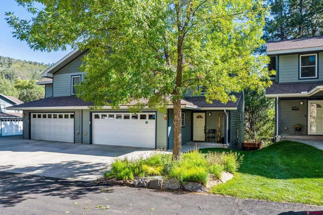front view of a house with a garden