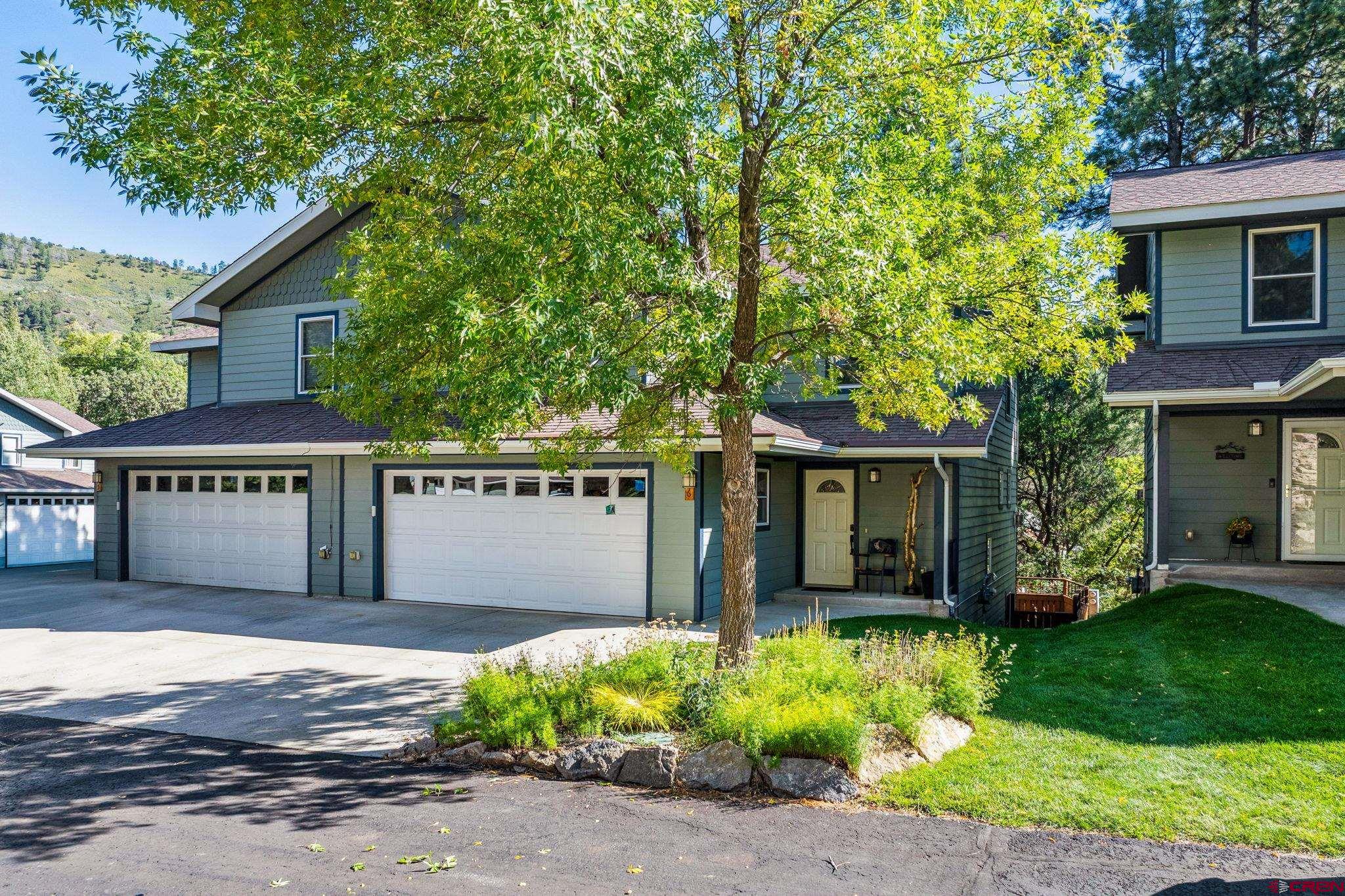 front view of a house with a garden