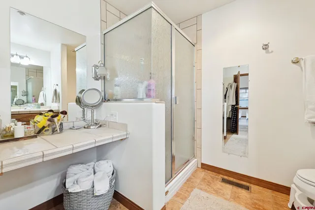 a view of a bathroom sink and a mirror