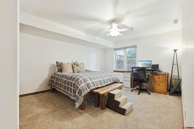 a spacious bathroom with a tub sink and mirror
