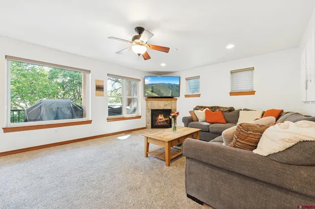 a living room with furniture and a fireplace