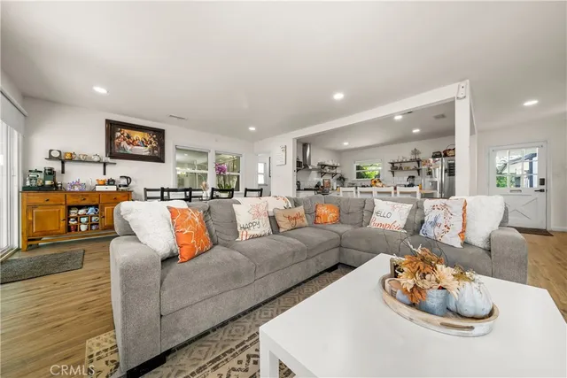 a living room with furniture kitchen and kitchen view