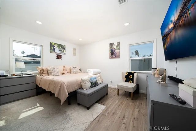 a spacious bedroom with a bed and a couch