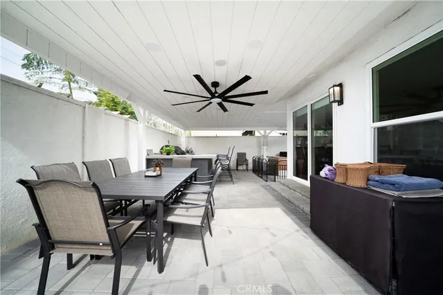 a view of a dining room with furniture and a flat screen tv