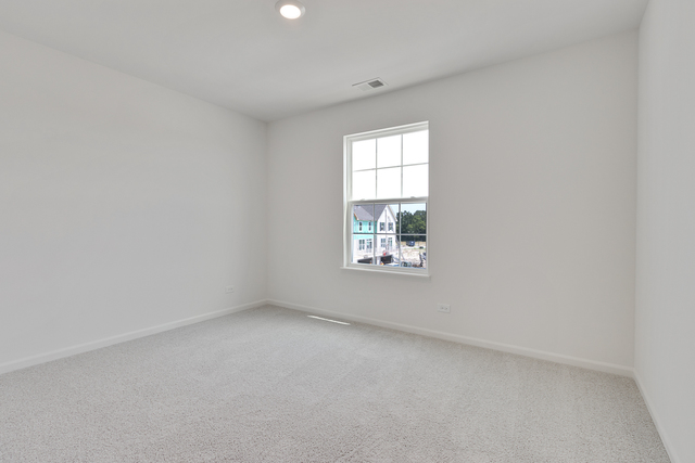 1652 Kraft Avenue Batavia, IL 60510 - Photo 19 of 25 an empty room with windows