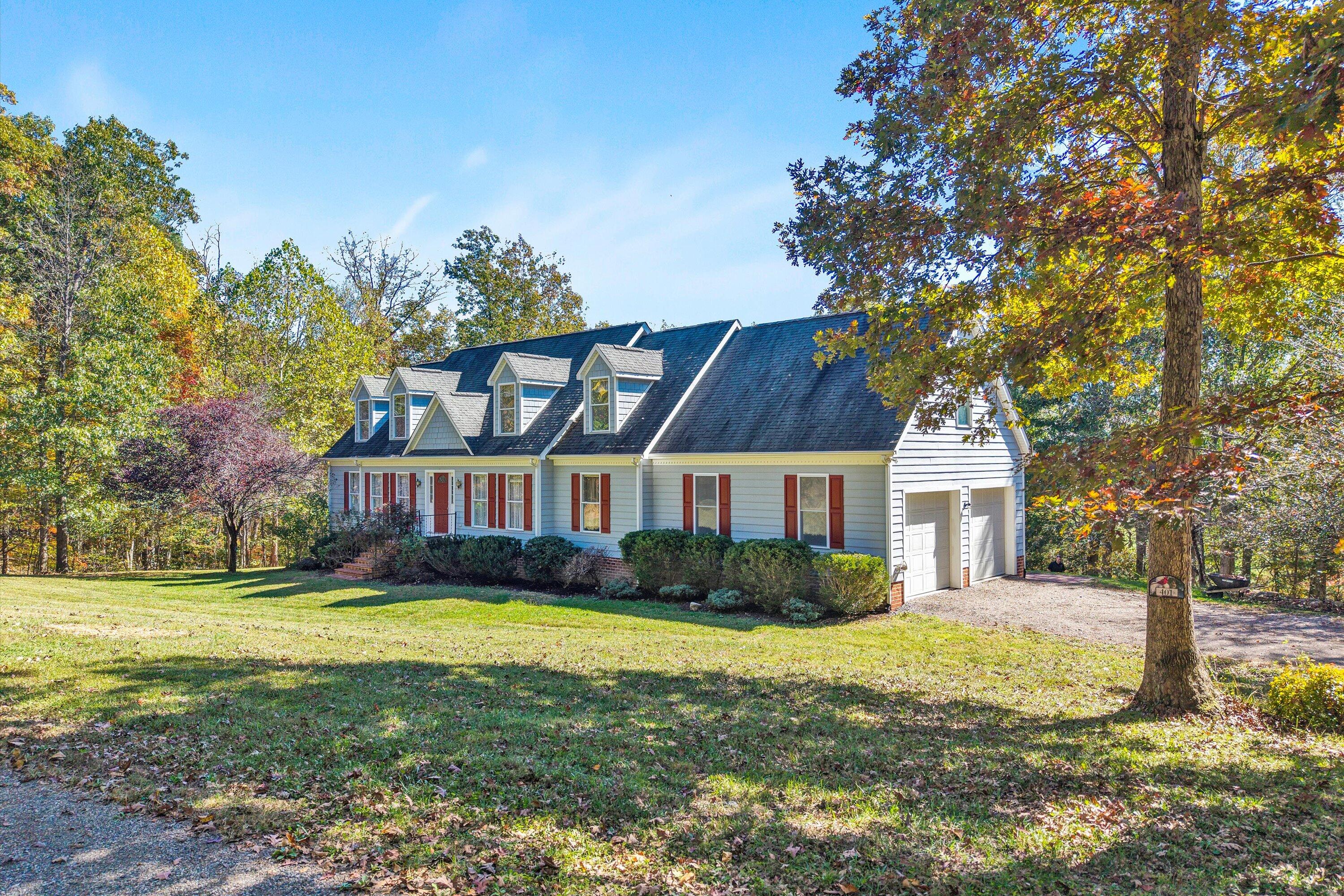 401 Piney Ridge Road Covington, VA 24426 - Photo 1 of 83 a view of a house with a big yard and large trees