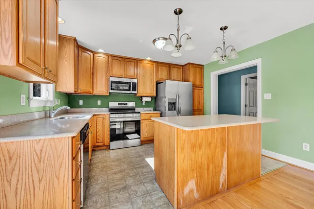 a bedroom with a bed and a dresser in it