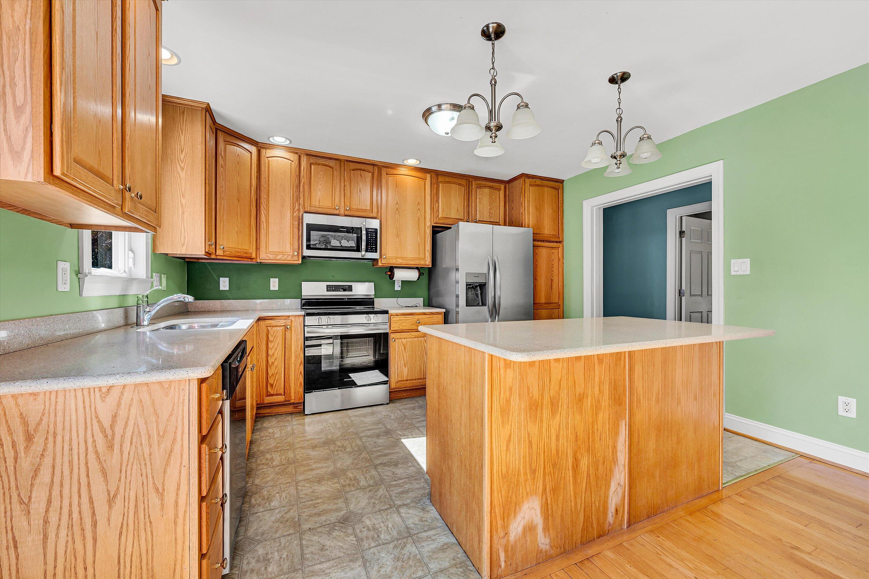 401 Piney Ridge Road Covington, VA 24426 - Photo 11 of 83 a kitchen with stainless steel appliances granite countertop a sink a stove and a refrigerator