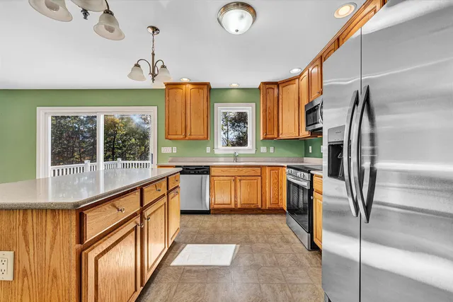 a bedroom with a bed and a dresser in it