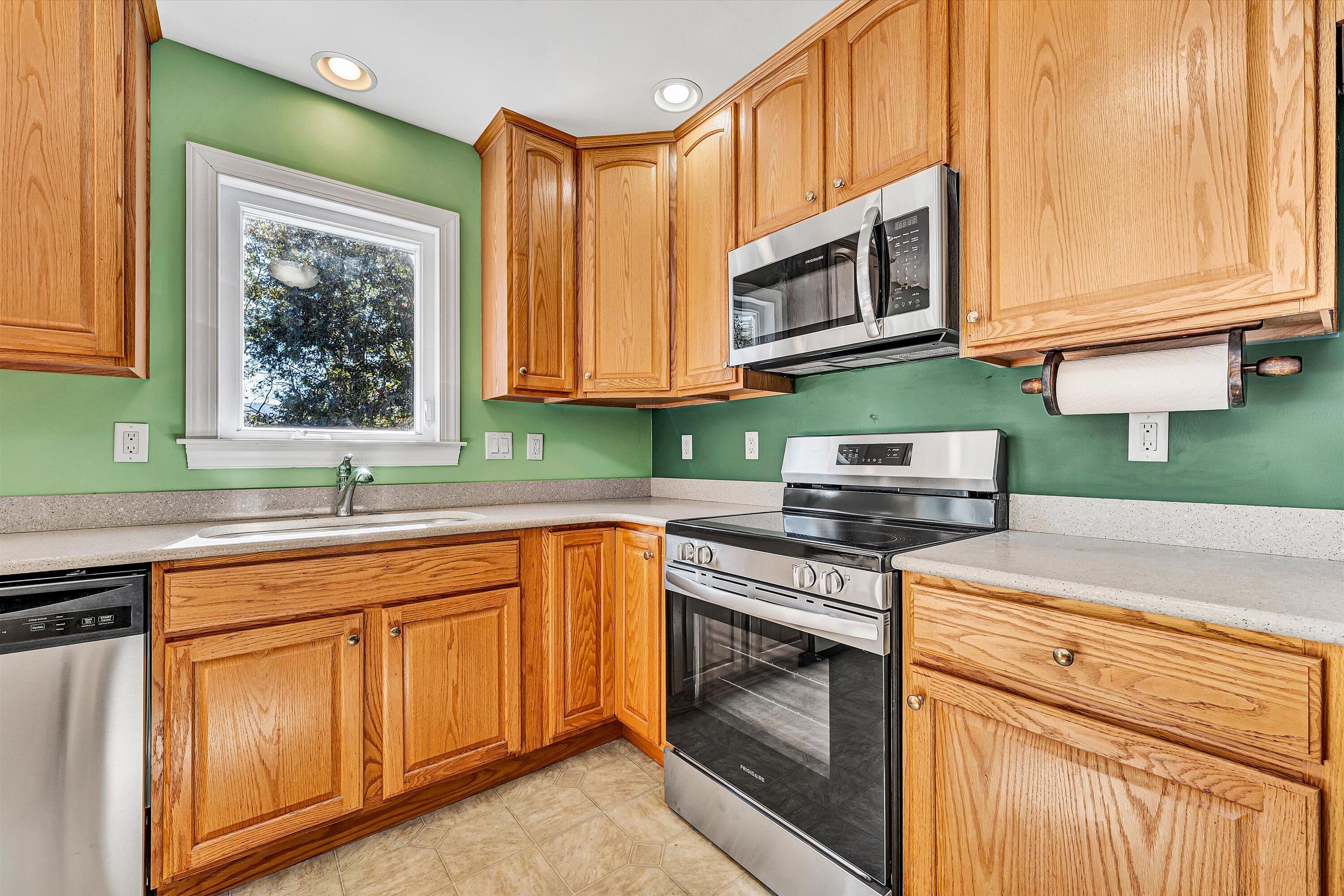 401 Piney Ridge Road Covington, VA 24426 - Photo 14 of 83 a kitchen with stainless steel appliances granite countertop a stove a sink and a microwave