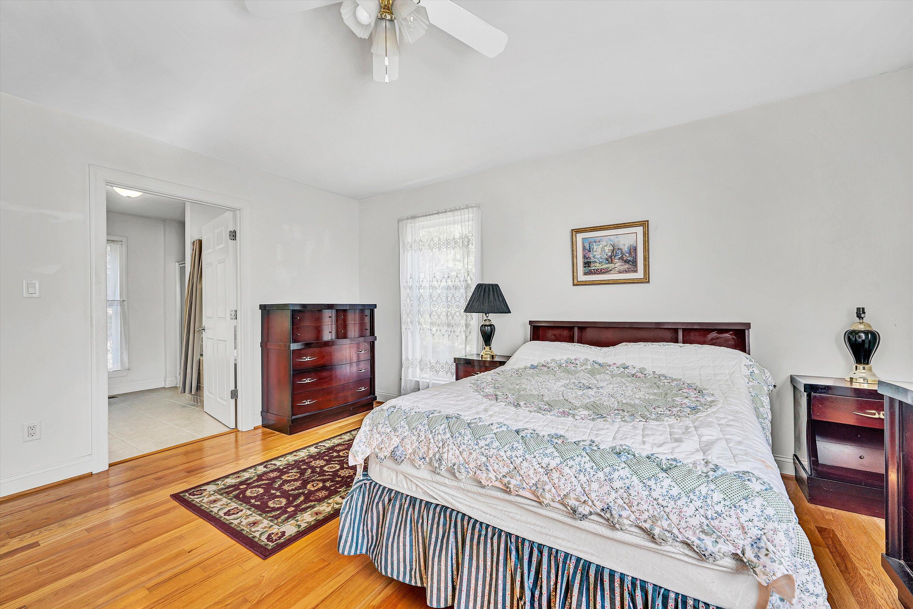 401 Piney Ridge Road Covington, VA 24426 - Photo 24 of 83 a bedroom with a bed and a dresser in it