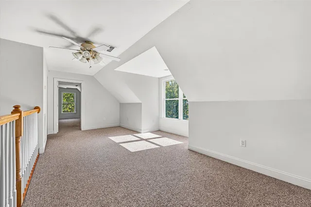 a view of a livingroom with an empty space and a window