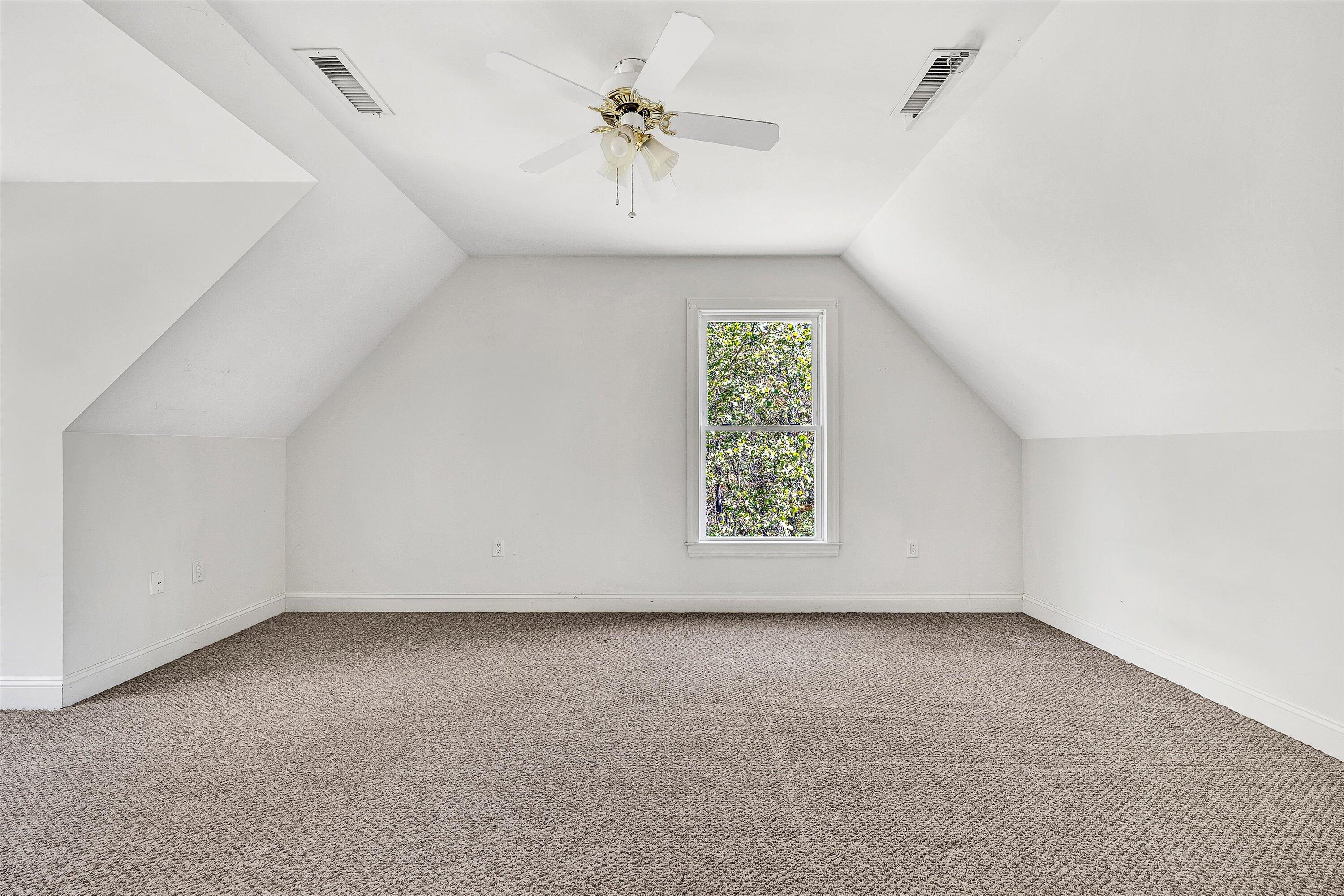 401 Piney Ridge Road Covington, VA 24426 - Photo 33 of 83 an empty room with a window and a ceiling fan