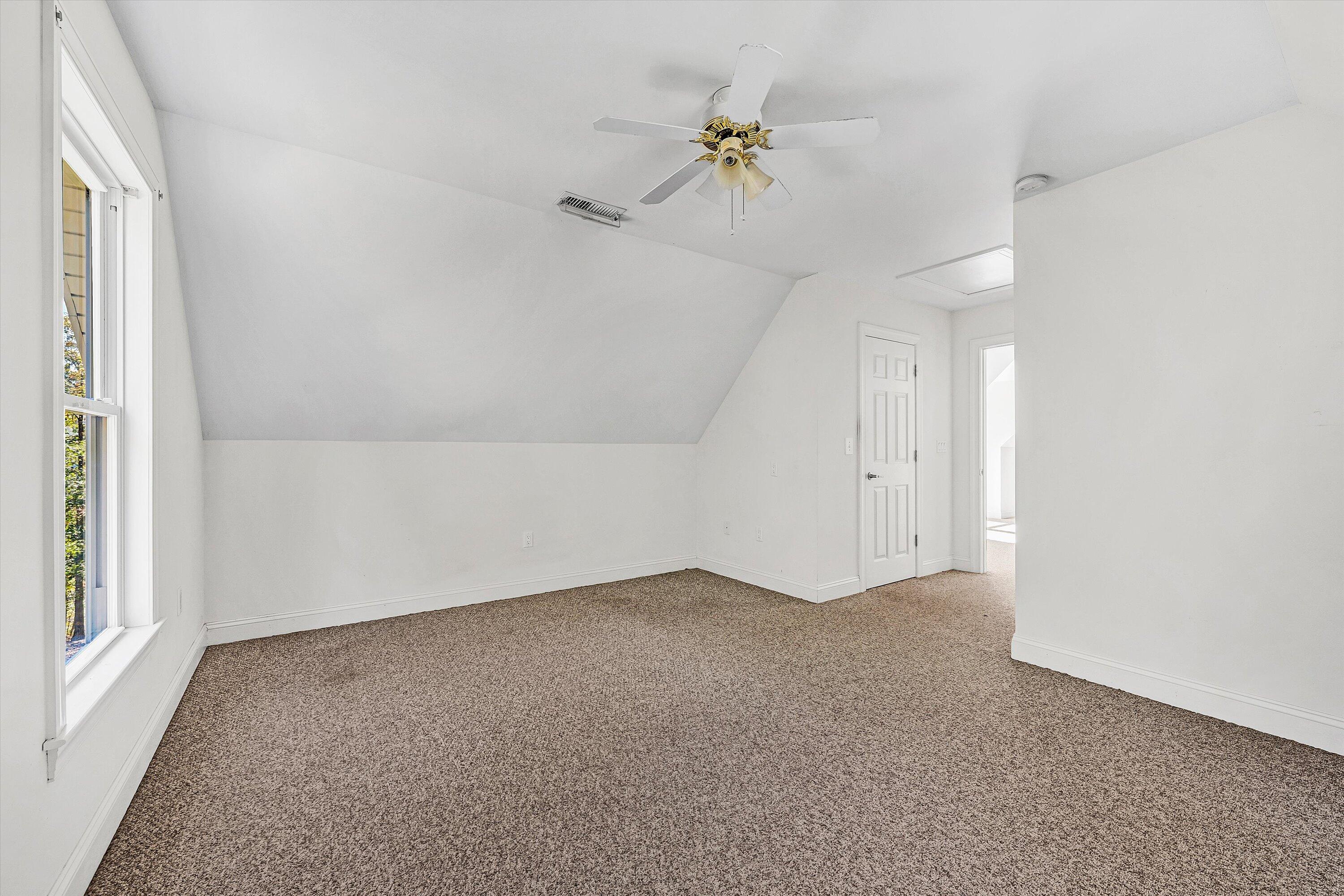 401 Piney Ridge Road Covington, VA 24426 - Photo 35 of 83 an empty room with a window and ceiling fan