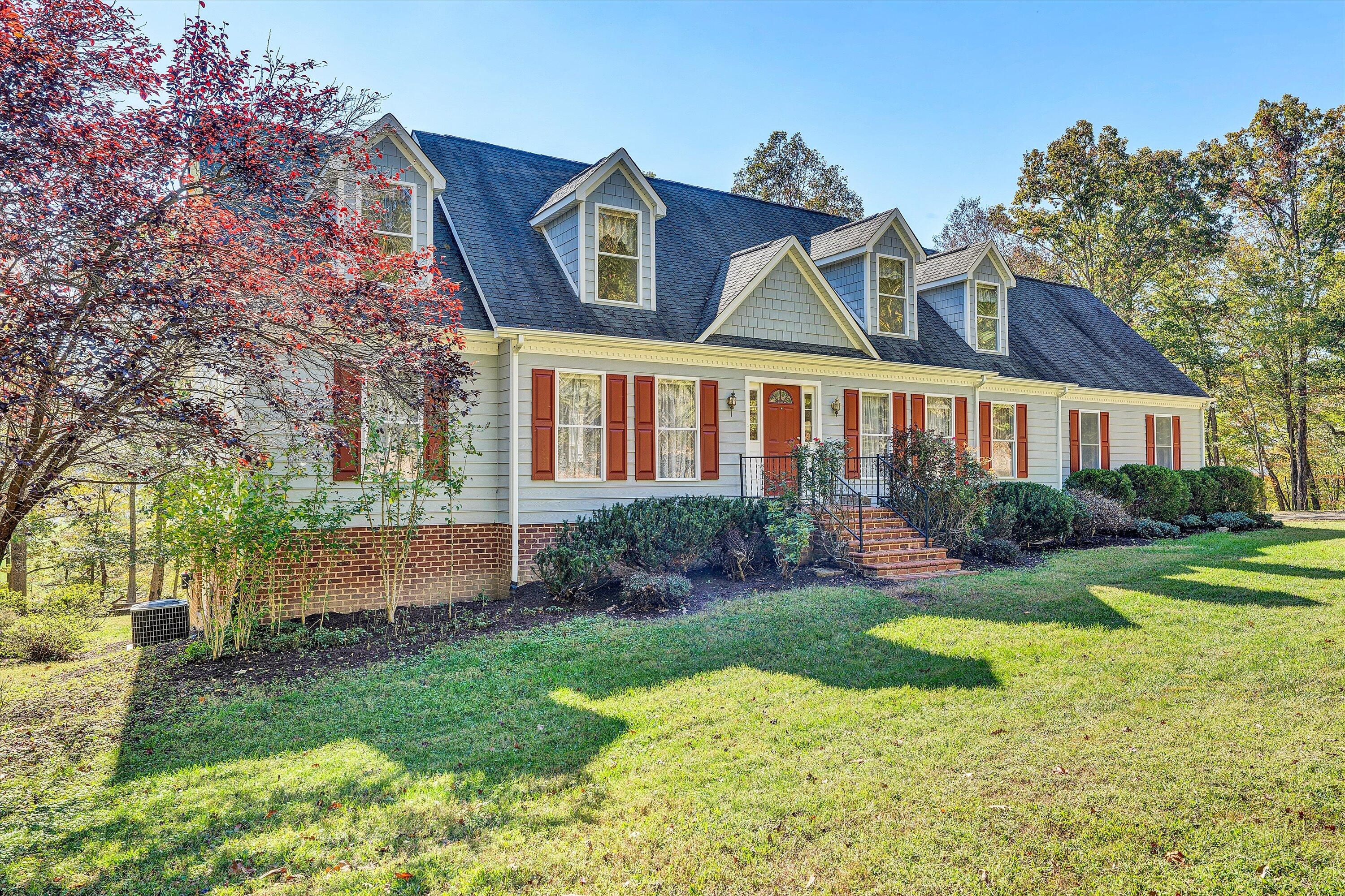 401 Piney Ridge Road Covington, VA 24426 - Photo 4 of 83 a view of a house with a big yard and potted plants