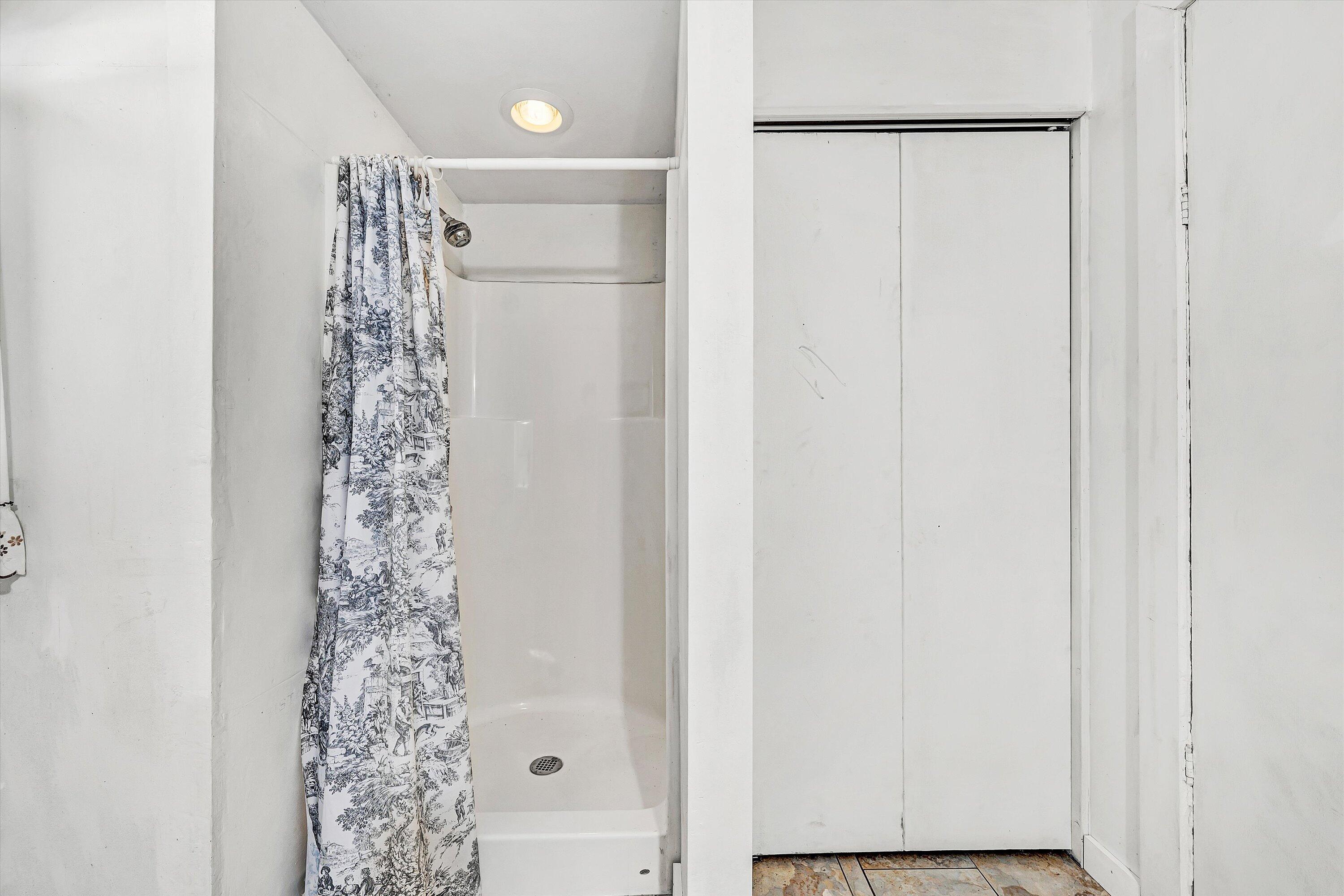 401 Piney Ridge Road Covington, VA 24426 - Photo 47 of 83 a bathroom with a shower curtain and a curtain