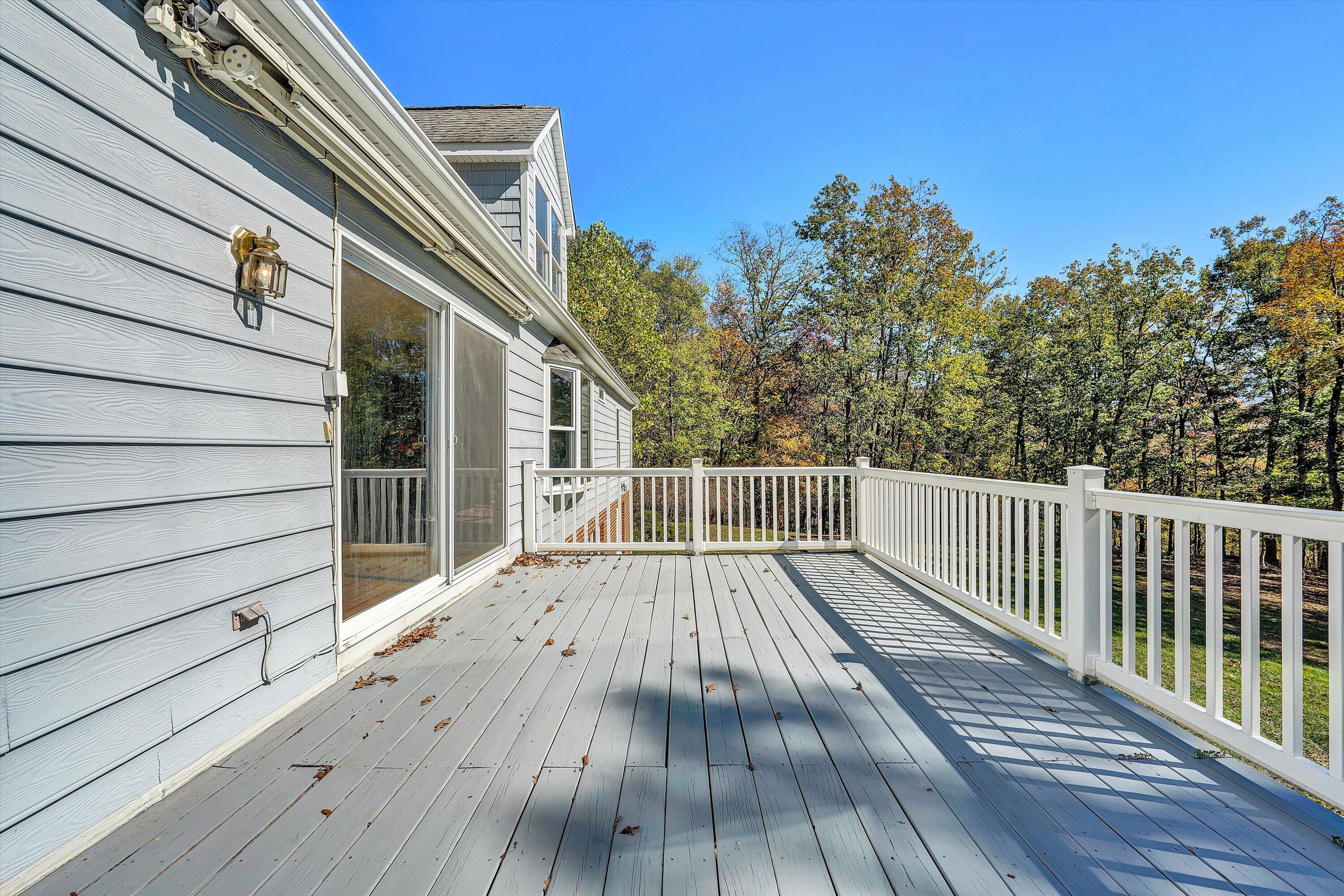 401 Piney Ridge Road Covington, VA 24426 - Photo 52 of 83 a view of deck with wooden floor and fence with a pot