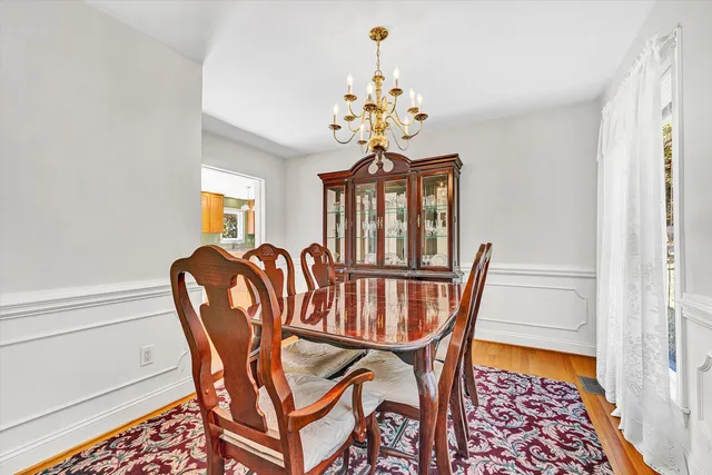 a kitchen with stainless steel appliances granite countertop a sink refrigerator and cabinets