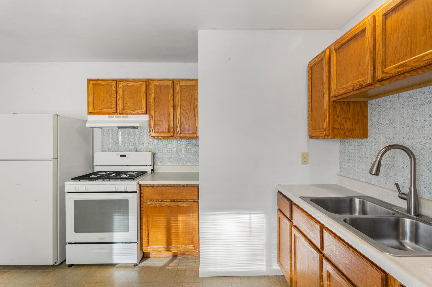 1504 North Mattis Avenue Champaign, IL 61821 - Photo 11 of 21 a kitchen with granite countertop a sink a stove and cabinets