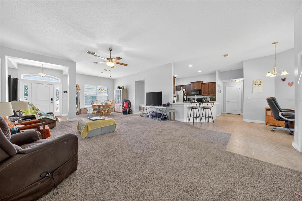 2005 Angel Fish Loop Leesburg, FL 34748 - Photo 13 of 54 a living room with furniture and a flat screen tv