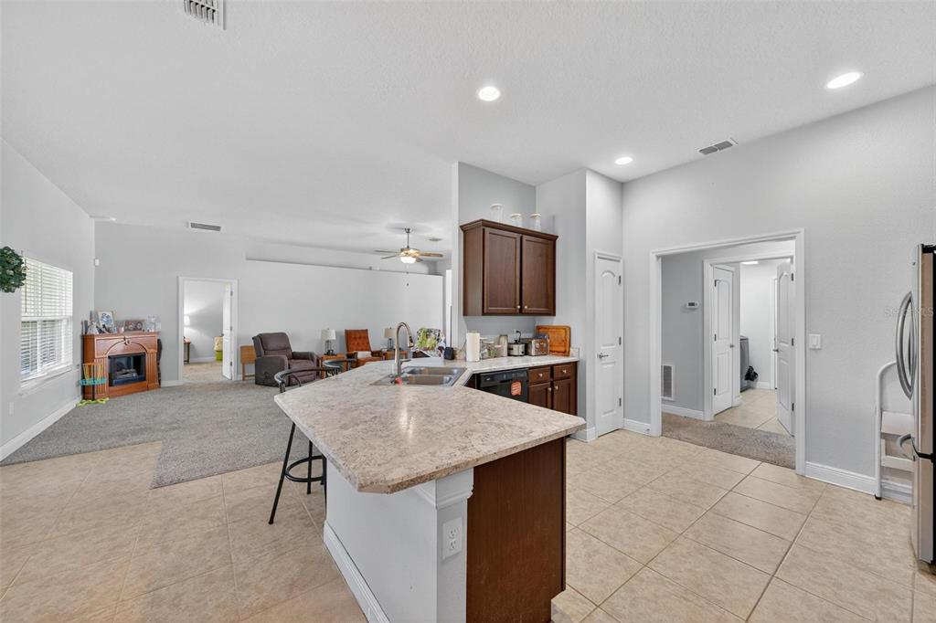 2005 Angel Fish Loop Leesburg, FL 34748 - Photo 22 of 54 a view of kitchen with sink microwave and refrigerator