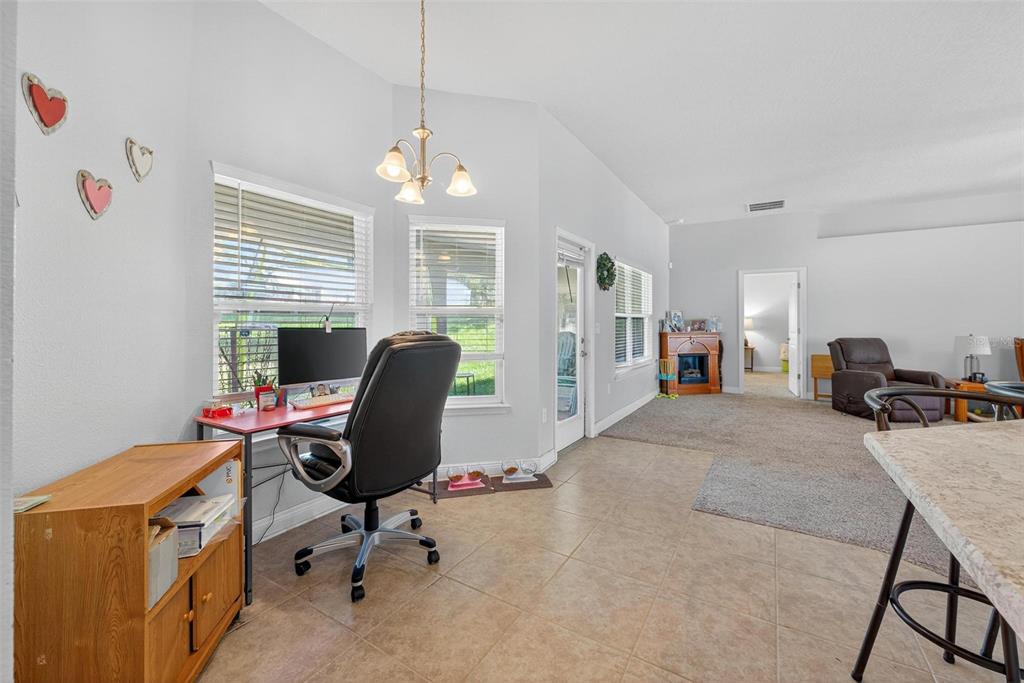 2005 Angel Fish Loop Leesburg, FL 34748 - Photo 33 of 54 a view of a workspace with furniture and a window
