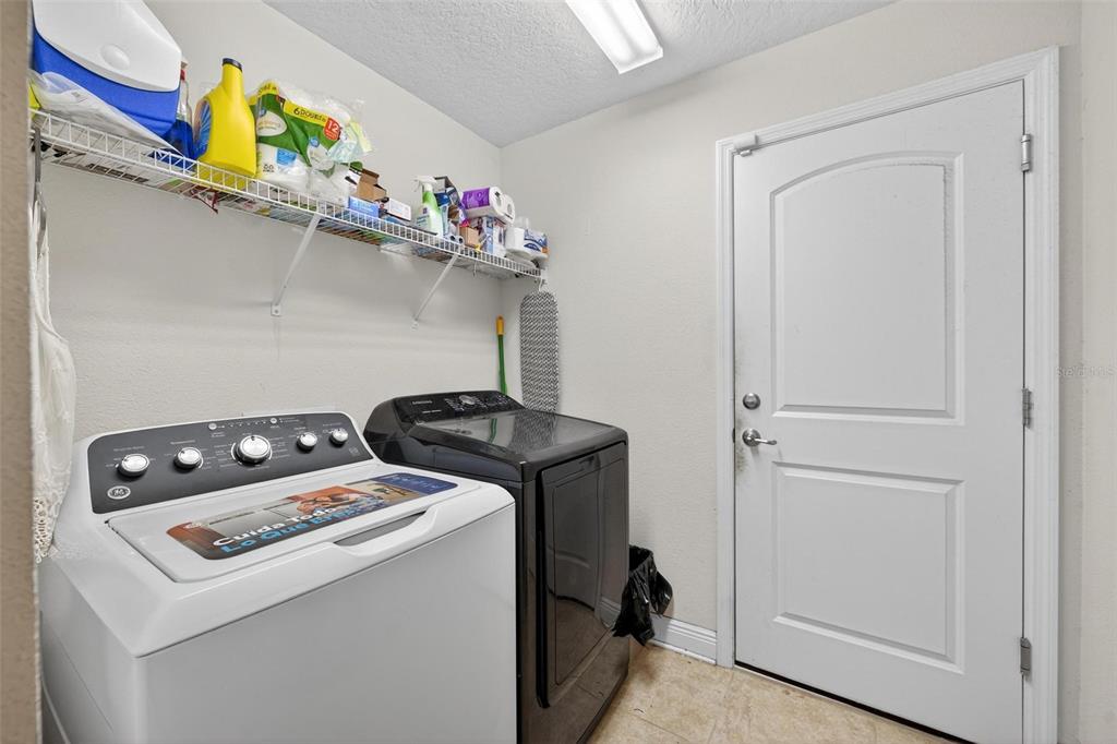 2005 Angel Fish Loop Leesburg, FL 34748 - Photo 34 of 54 a utility room with dryer and washer
