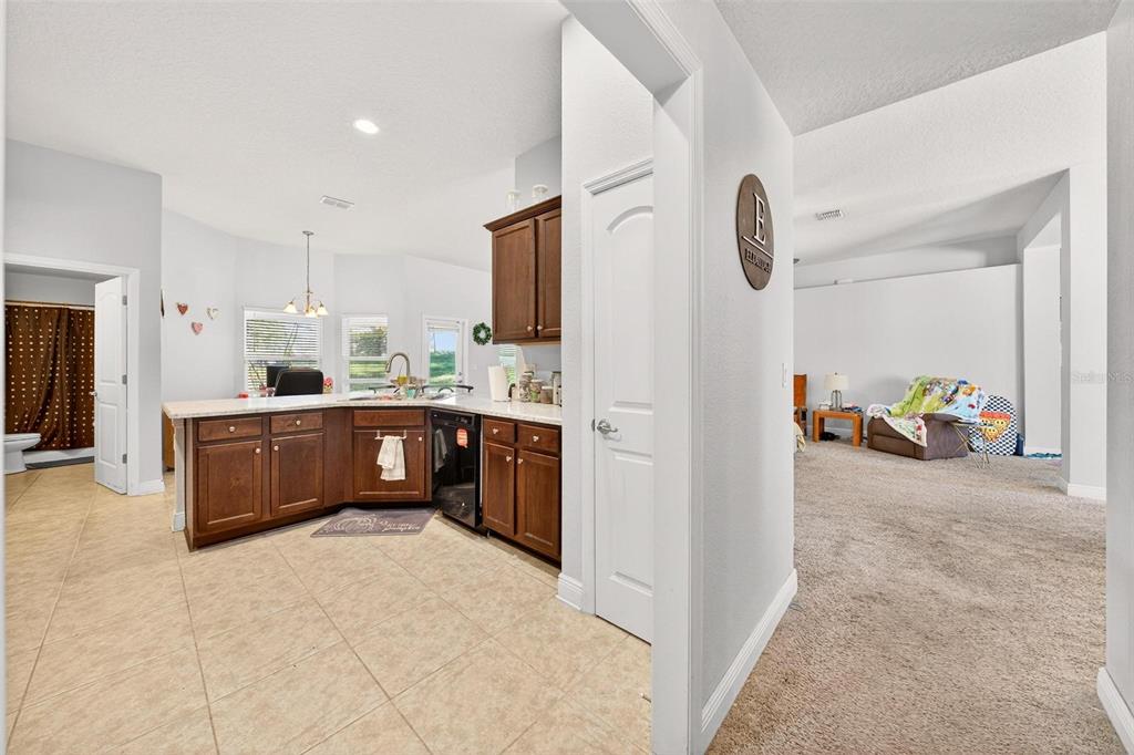 2005 Angel Fish Loop Leesburg, FL 34748 - Photo 39 of 54 a kitchen with stainless steel appliances a sink a counter top space cabinets and a window