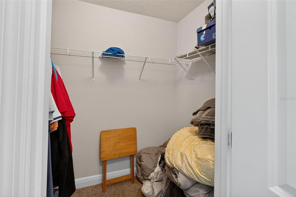2005 Angel Fish Loop Leesburg, FL 34748 - Photo 43 of 54 a view of walk in closet with clothes and shoes