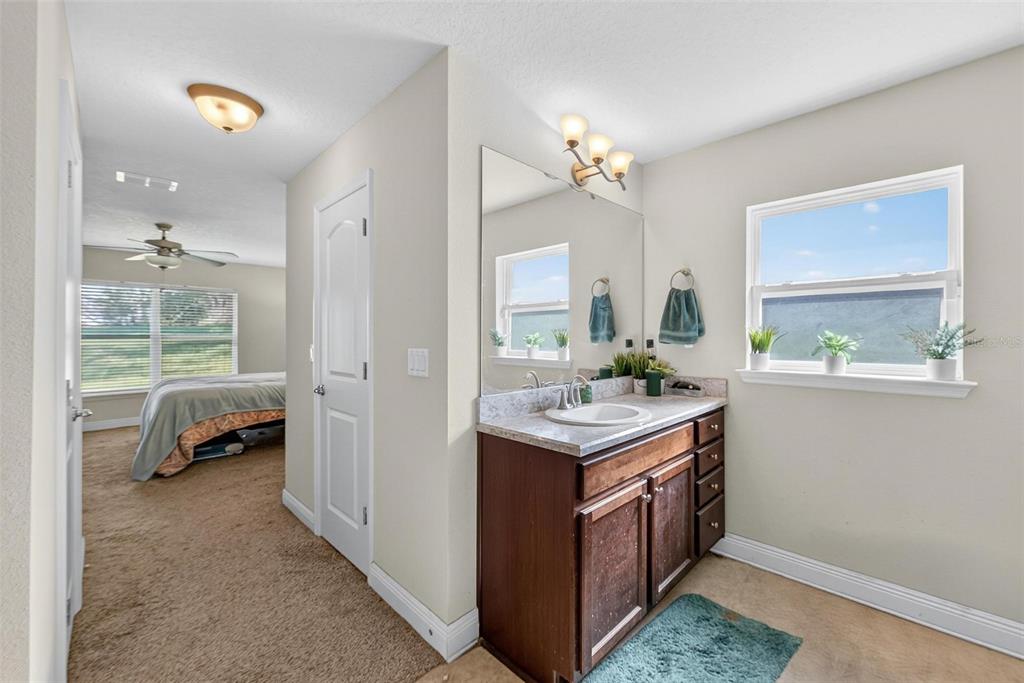 2005 Angel Fish Loop Leesburg, FL 34748 - Photo 47 of 54 a kitchen with a stove and a sink