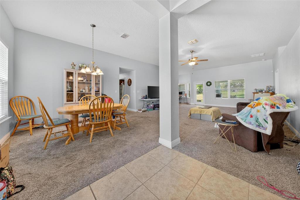 2005 Angel Fish Loop Leesburg, FL 34748 - Photo 7 of 54 a view of a dining room with furniture and chandelier