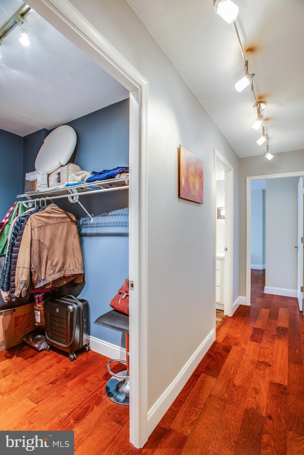 2201 L Street Northwest, Unit 500 Washington, DC 20037 - Photo 13 of 43 a bedroom with a bed and a view of closet