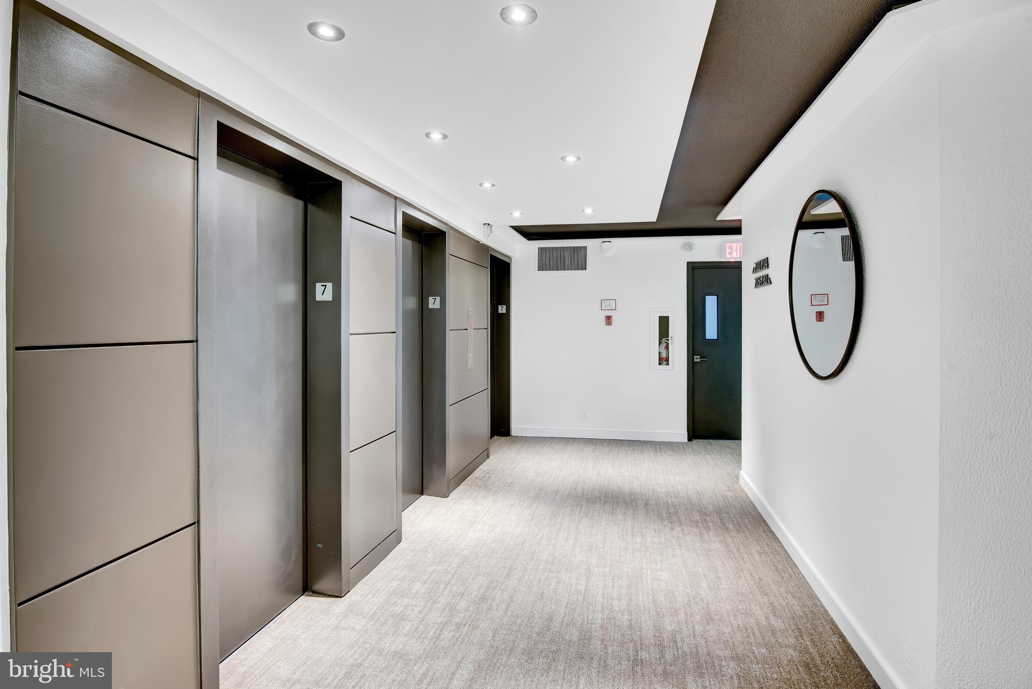 2201 L Street Northwest, Unit 500 Washington, DC 20037 - Photo 21 of 43 a view of a hallway with painted walls