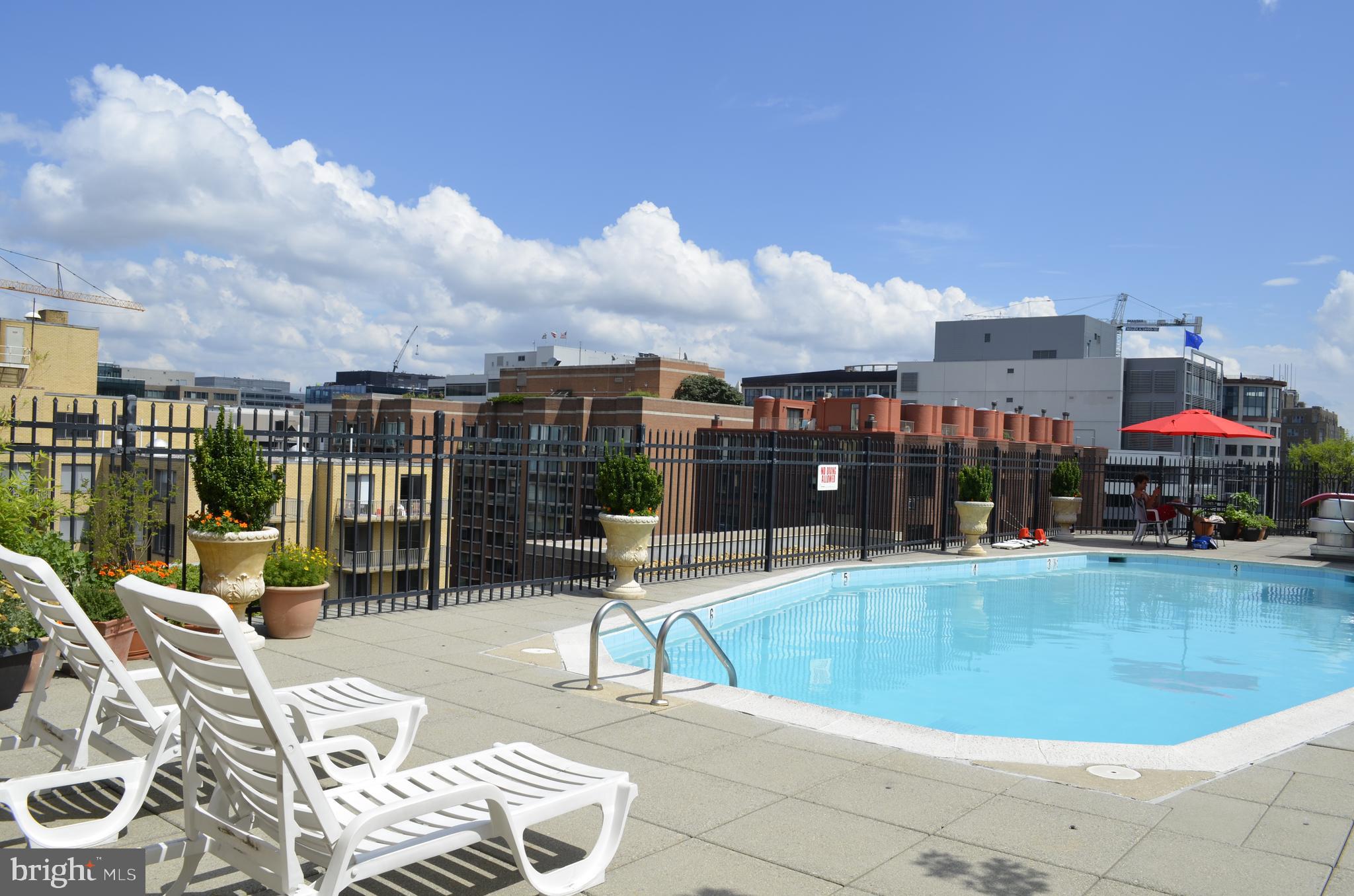 2201 L Street Northwest, Unit 500 Washington, DC 20037 - Photo 25 of 43 a view of a swimming pool with seating space