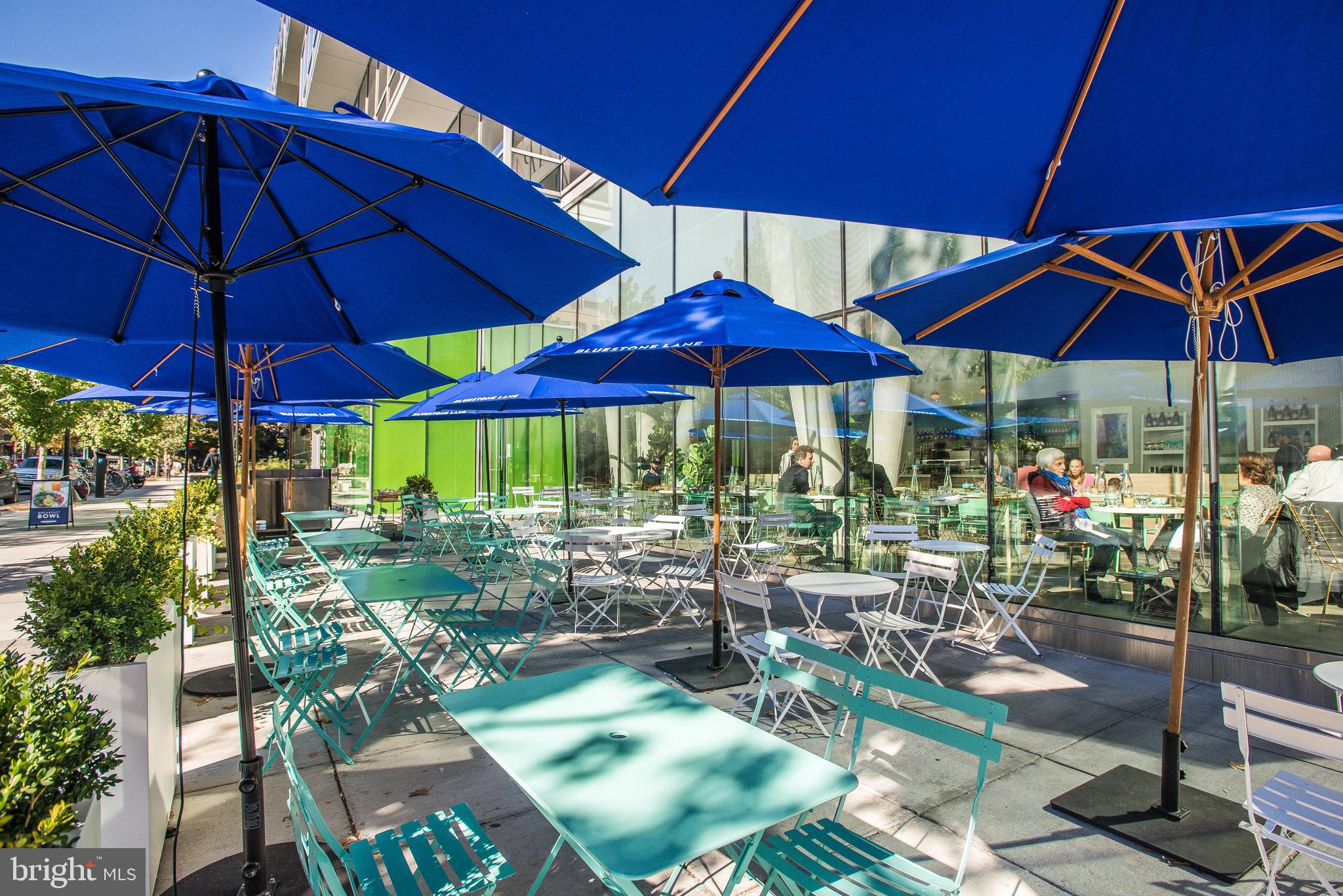 2201 L Street Northwest, Unit 500 Washington, DC 20037 - Photo 34 of 43 a view of a table and chairs under an umbrella