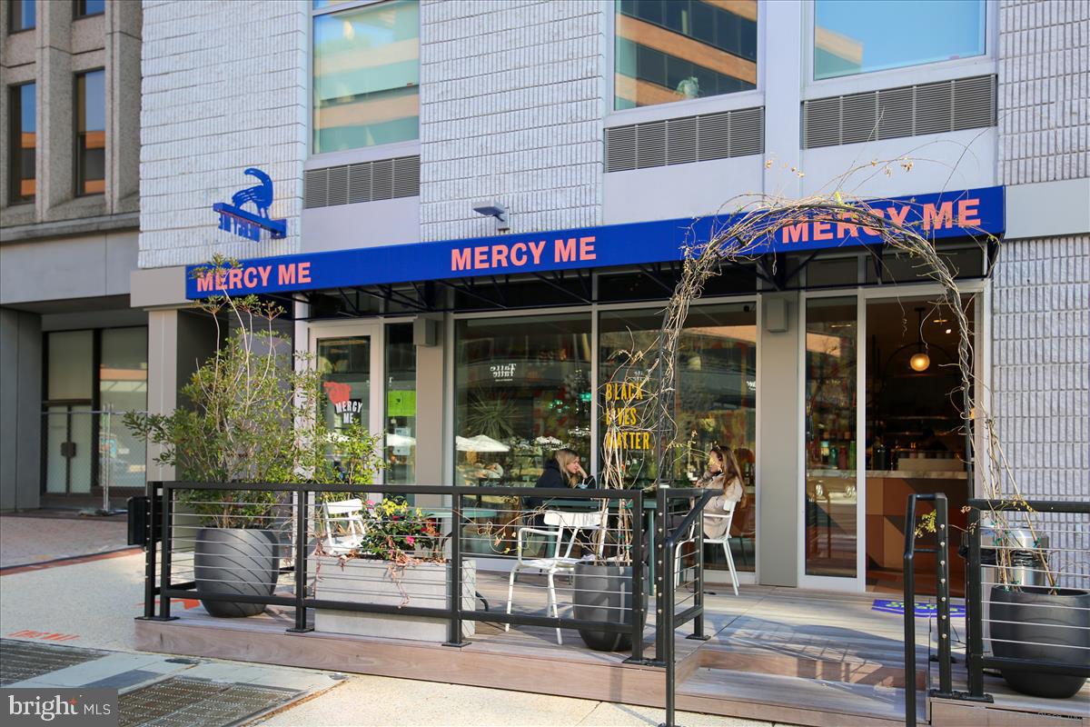 2201 L Street Northwest, Unit 500 Washington, DC 20037 - Photo 42 of 43 a view of a cafe with a table and chairs