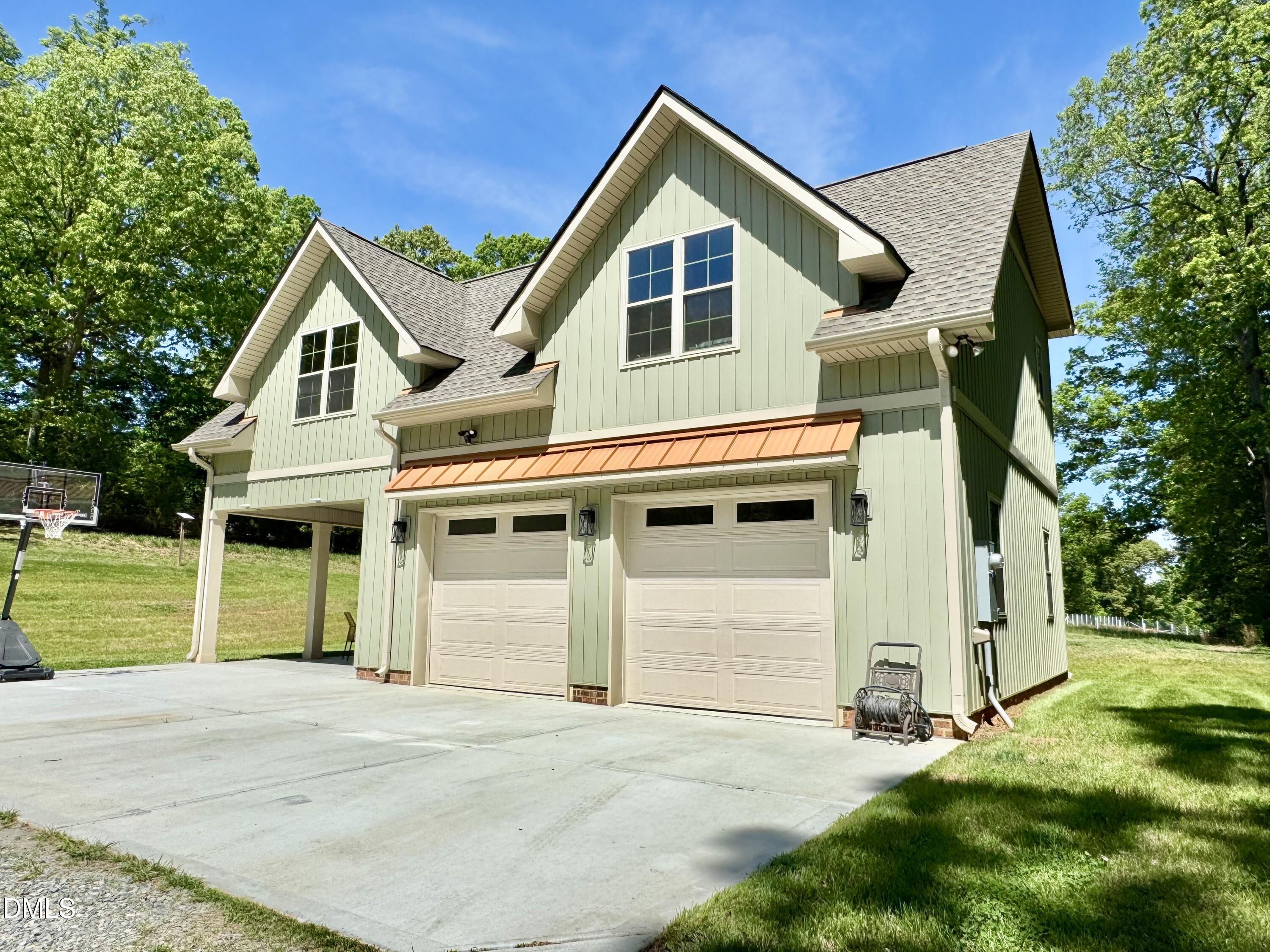 254 Fairway Drive Roxboro, NC 27574 - Photo 1 of 28 a front view of a house with a yard and garage