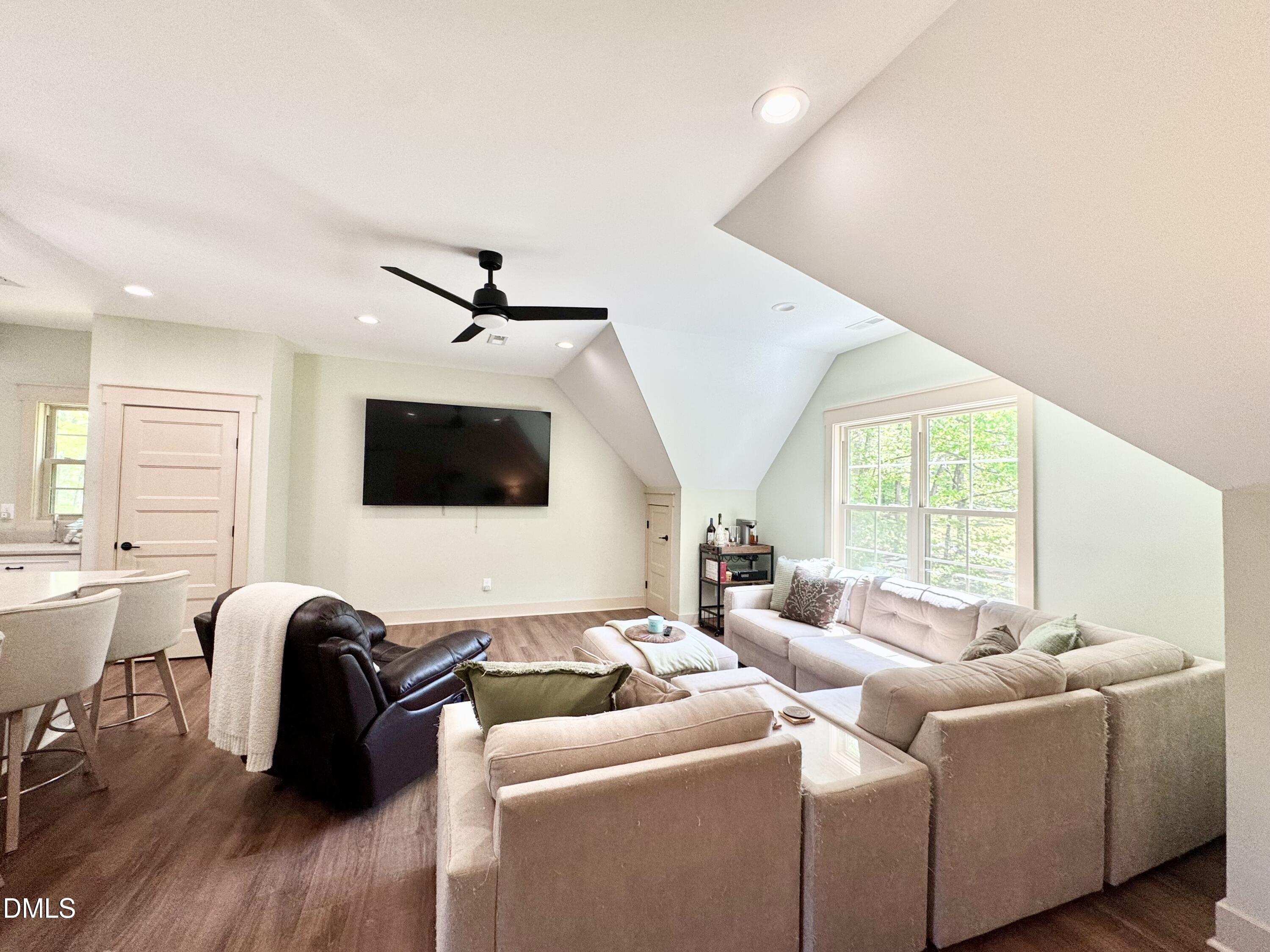 254 Fairway Drive Roxboro, NC 27574 - Photo 13 of 28 a living room with furniture and a flat screen tv