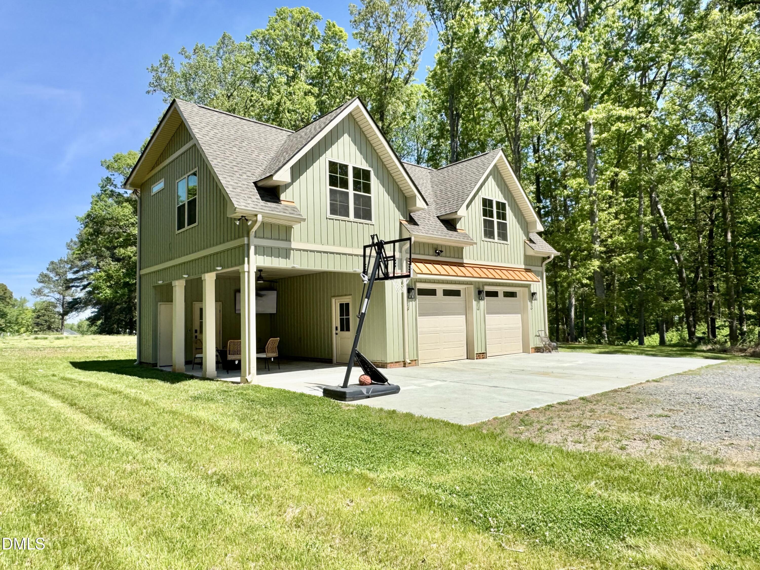 254 Fairway Drive Roxboro, NC 27574 - Photo 2 of 28 a view of a house with a yard and large trees