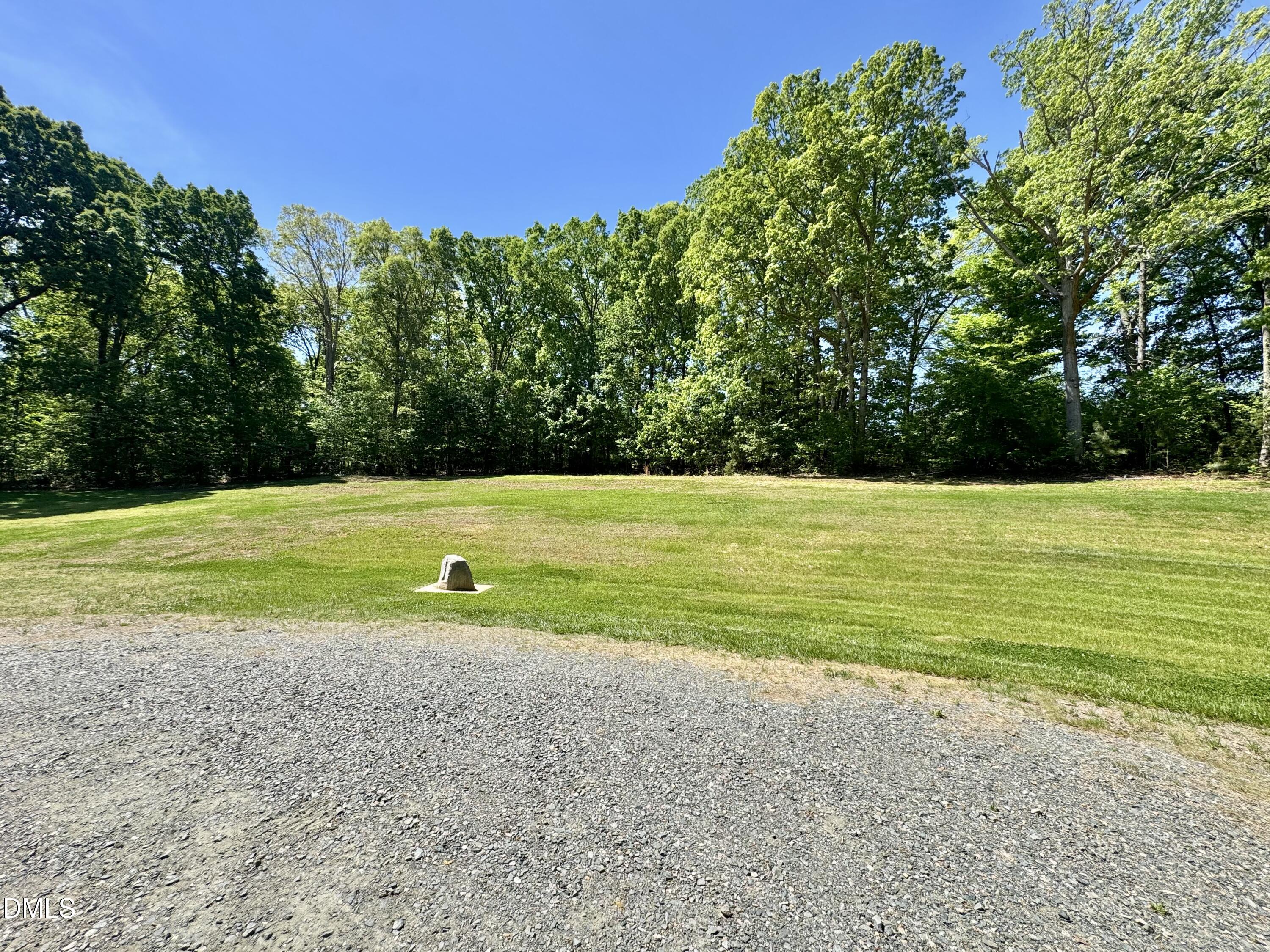 254 Fairway Drive Roxboro, NC 27574 - Photo 25 of 28 a view of a field with trees in the background