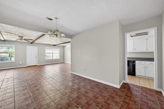 a view of a kitchen with a sink and a stove top oven