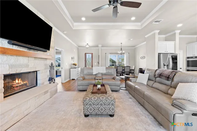 a kitchen with stainless steel appliances white cabinets and a sink