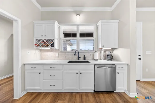 a view of living room with furniture flat screen tv and wooden floor