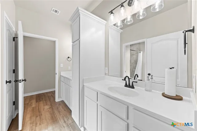 a bathroom with a bathtub shower