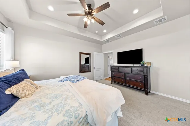 a spacious bathroom with a double vanity sink and a mirror