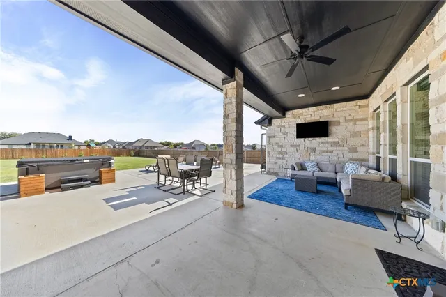 a view of a terrace with sitting area