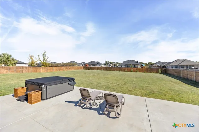 a front view of house with swimming pool yard fire pit and barbeque oven