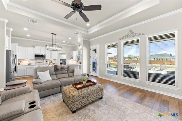 a living room with furniture fireplace and a flat screen tv
