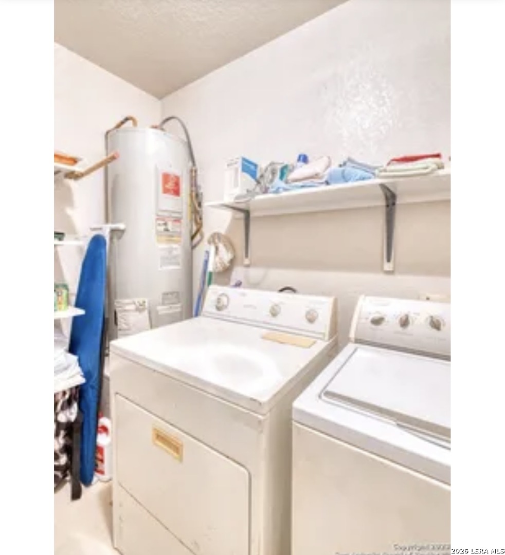 622 South Oak Street Pearsall, TX 78061 - Photo 19 of 22 a utility room with dryer and washer