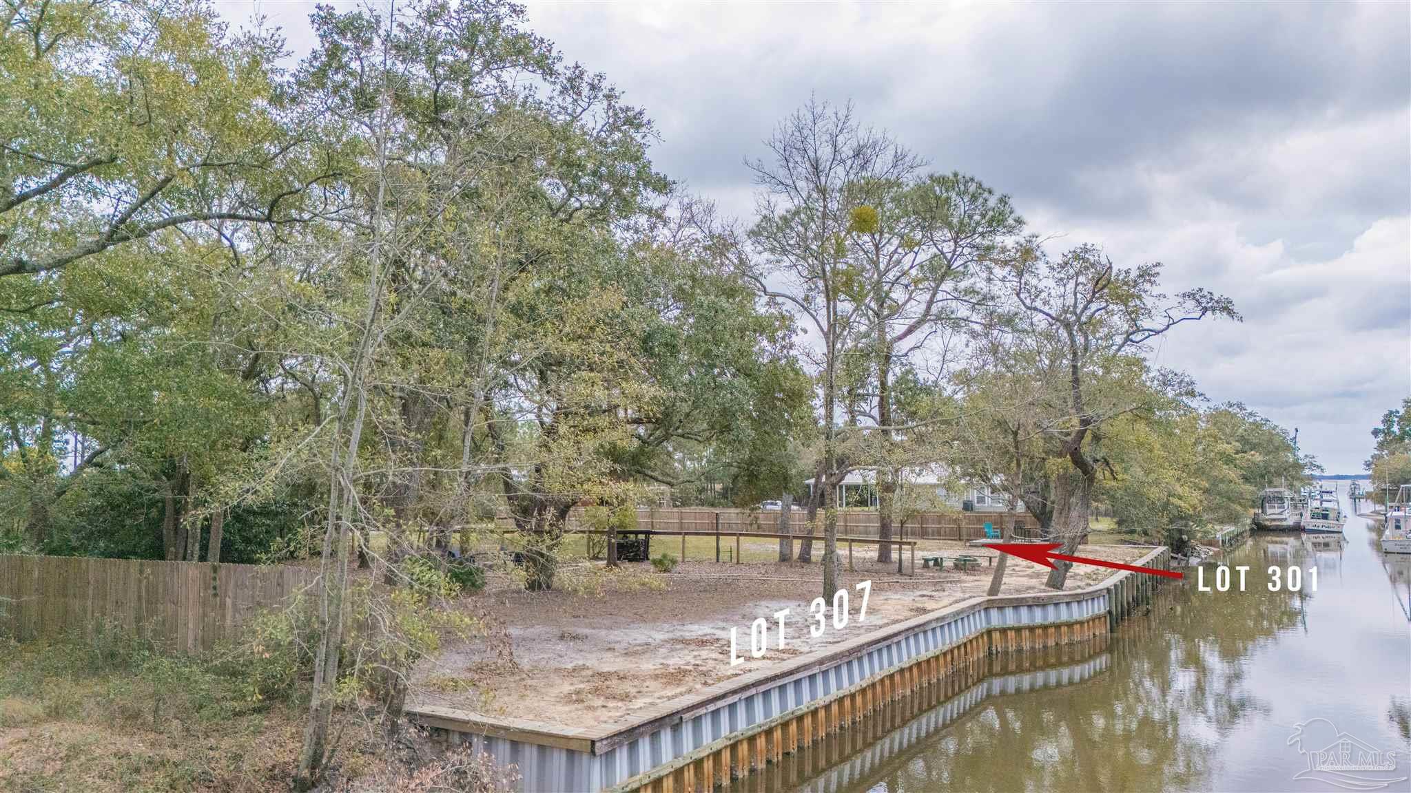 307 Katie Street Milton, FL 32583 - Photo 11 of 17 a view of roof deck with two couches and wooden floor